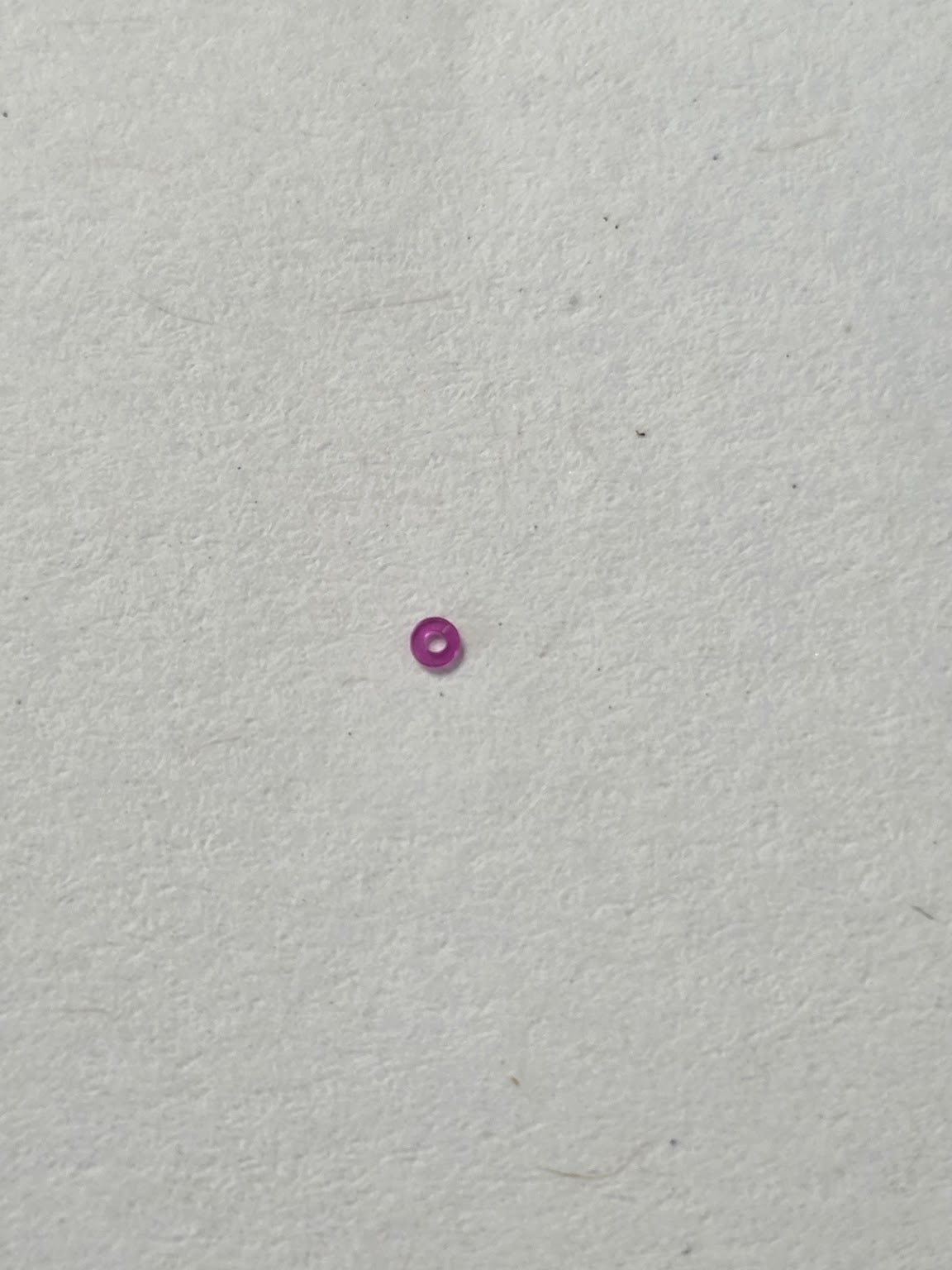 Rubis / pierre de centre d'origine sous papier de soie (dim. 77/120) - HS (H. Sandoz & Fils / Henschoz SA) - HSP 75 / Pierre de centre (77/120)